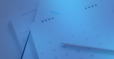 Calendar with a blue background and a pencil on top.